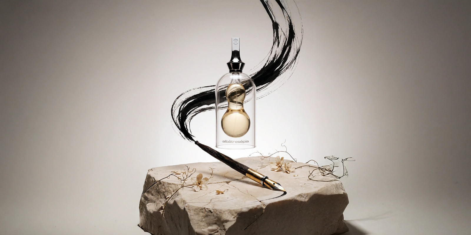 Albatre Sepia perfume bottle on alabaster stone with ink calligraphy brush